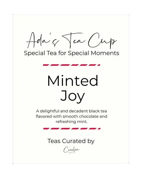 Ada's Tea Cup Minted Joy tea package with white label, black lettering, thin black inner border, and pink accent lines.